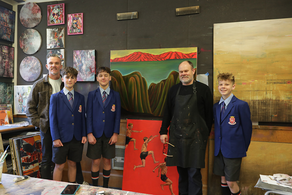 Three Wellesley College boys posing with Dean Proudfoot and Glen Jorna, smiling at the camera